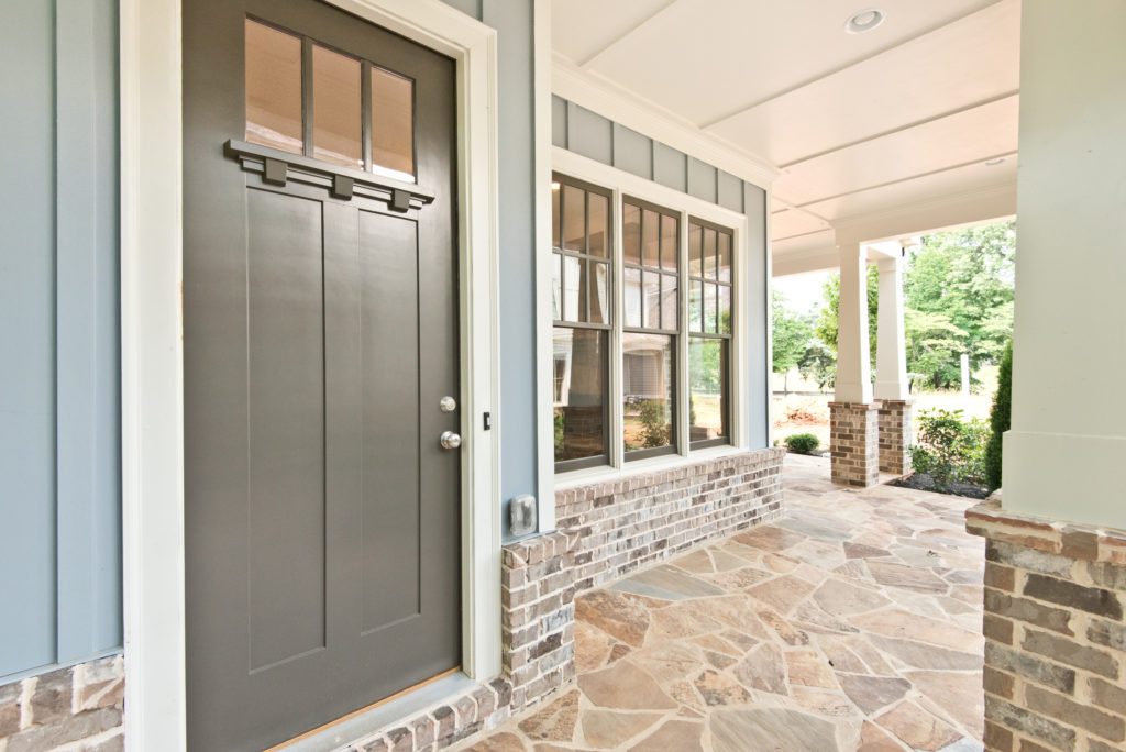 Maintenance tips for your new home - the beautiful front porch of a home in Adams VIneyard