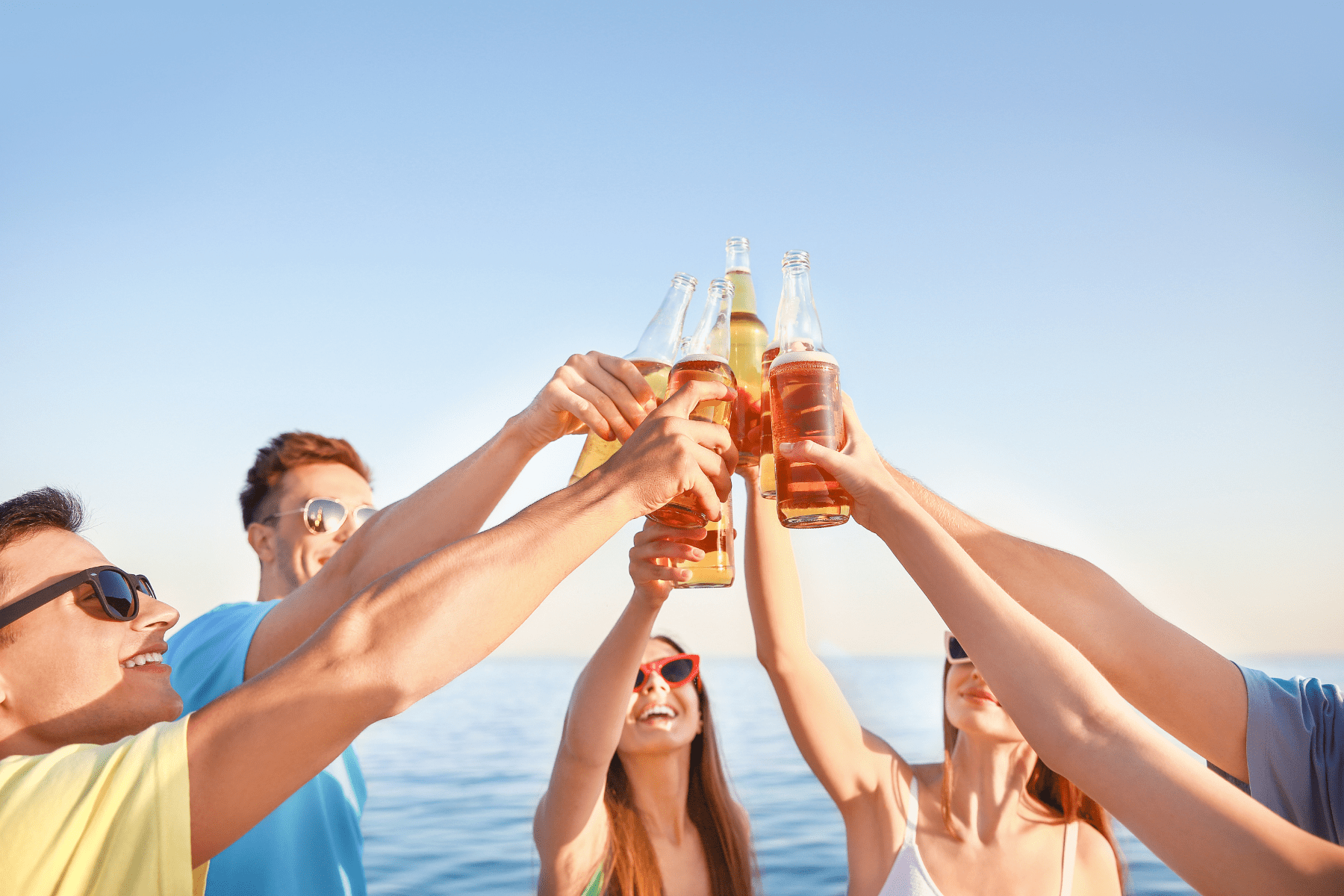 People holding beers at a 30A brewery