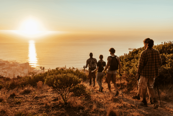 Group of friends exploring a 30A hiking trail by the ocean